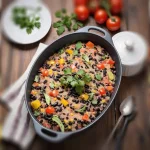Гювеч с черен боб на кухненска маса, домати, магдамоз, лъжица и вилица